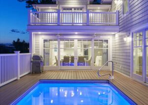 The pool area at a Bethany Beach rental to relax by with ice cream from a local spot.